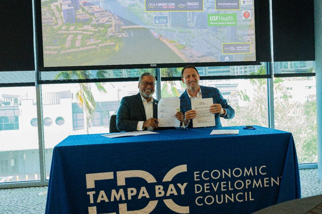 Tampa Bay EDC President and CEO Craig Richard and Tampa General Hospital President and CEO John Couris sign a Memorandum of Understanding for a partnership to grow the Tampa Medical and Research District.